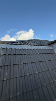 Completed roof replacement with new grey tiles in Stockport