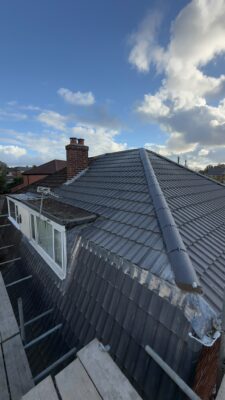 Completed tiled roof with chimney leadwork in Stockport